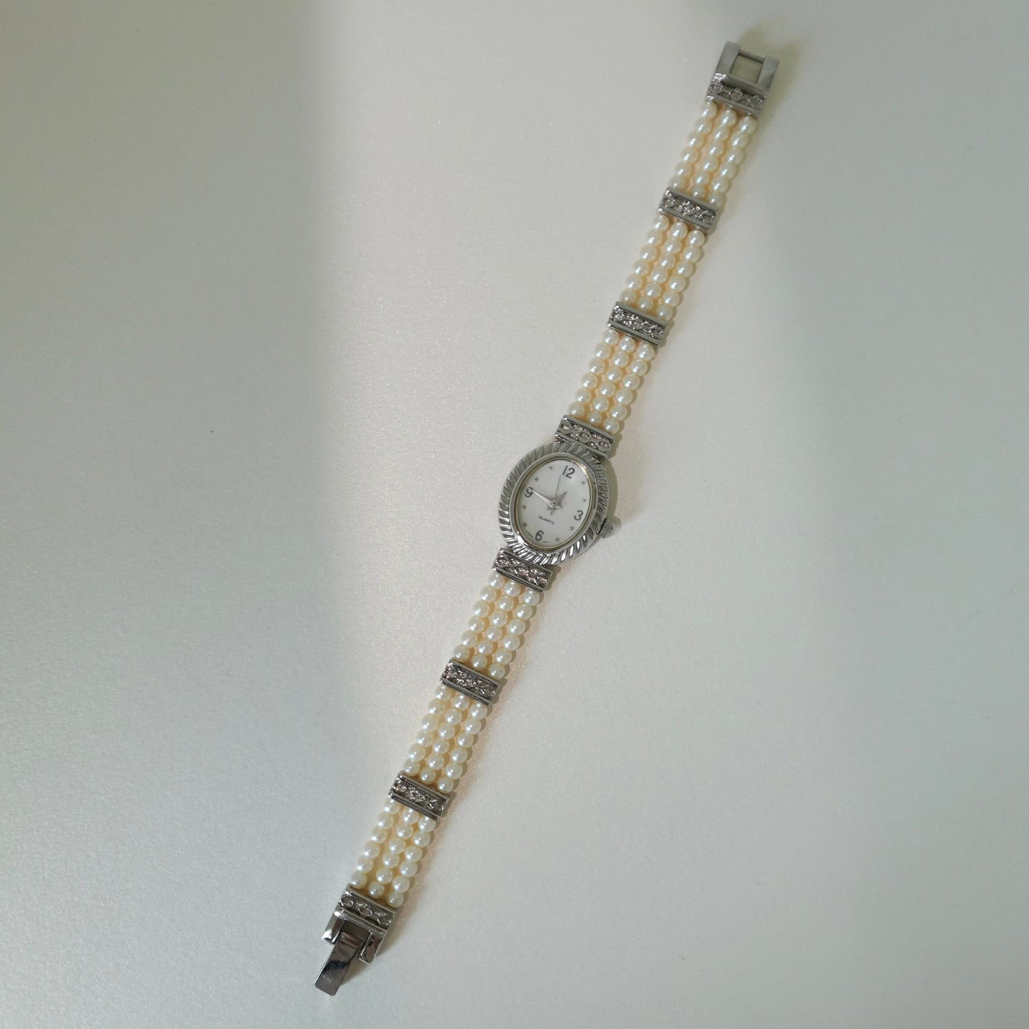 Oval faux peal bracelet watch