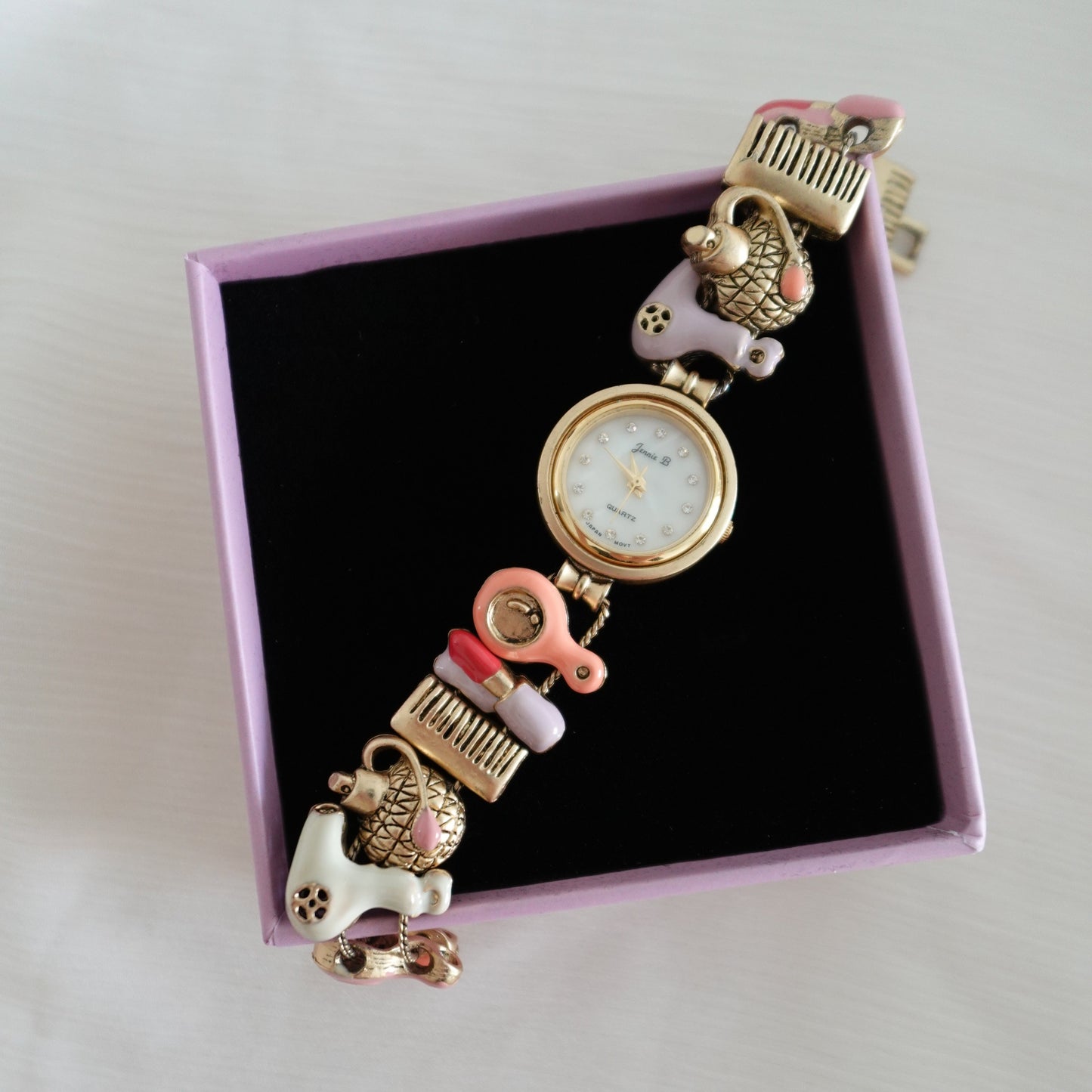 Gold beauty charms watch