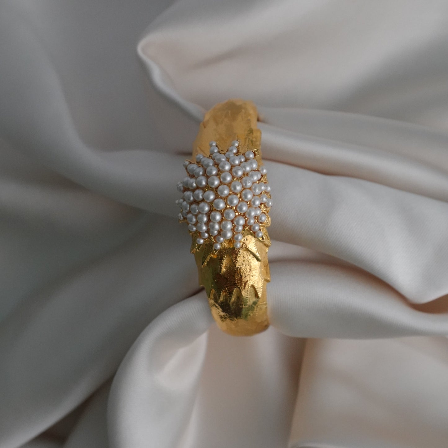 1960s peek-a-boo pearl bangle watch