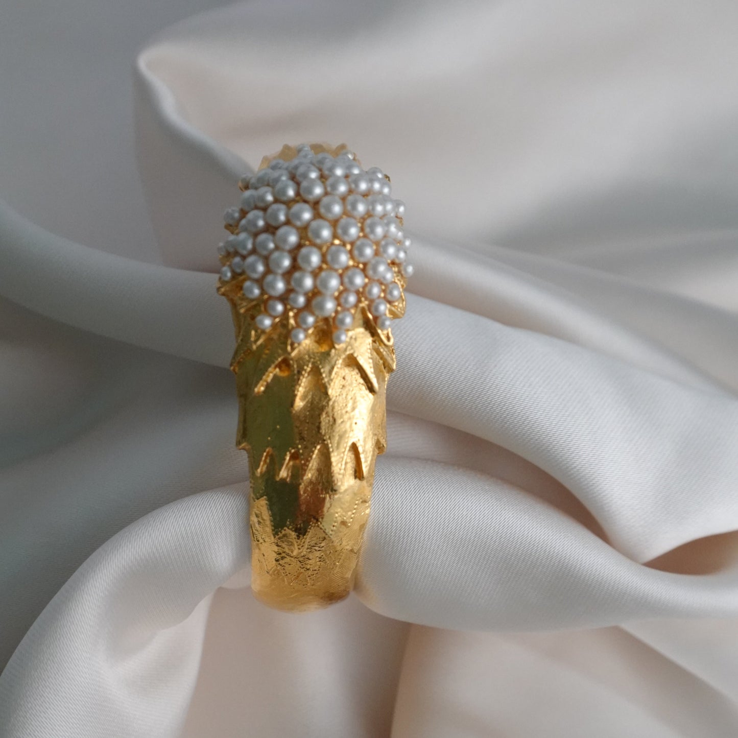 1960s peek-a-boo pearl bangle watch