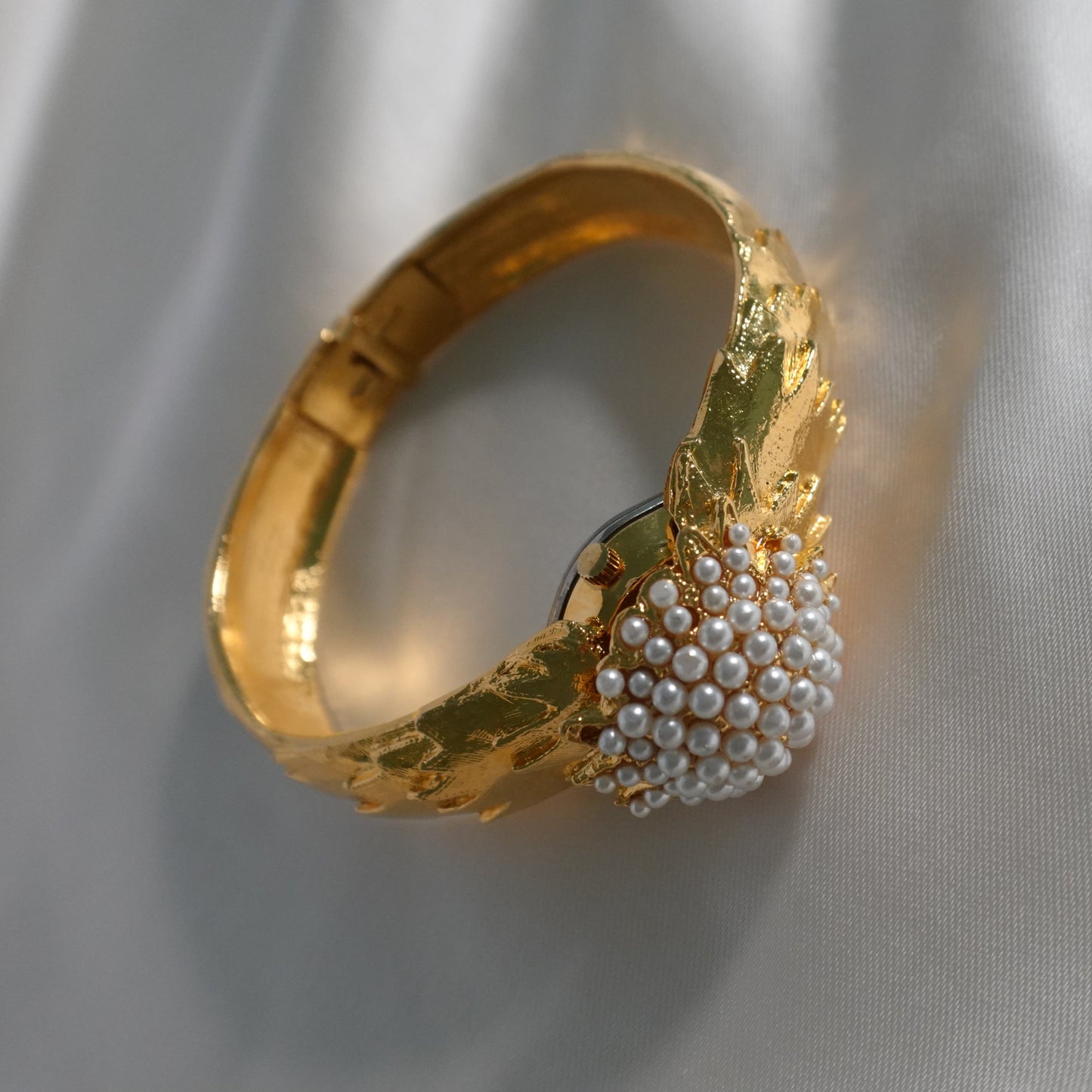 1960s peek-a-boo pearl bangle watch