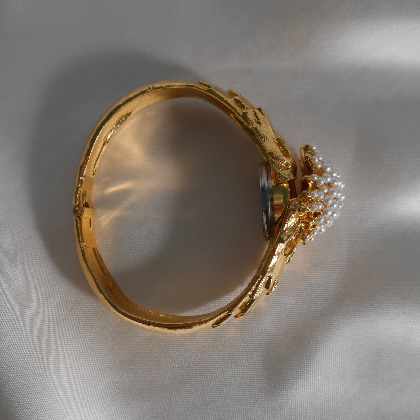 1960s peek-a-boo pearl bangle watch