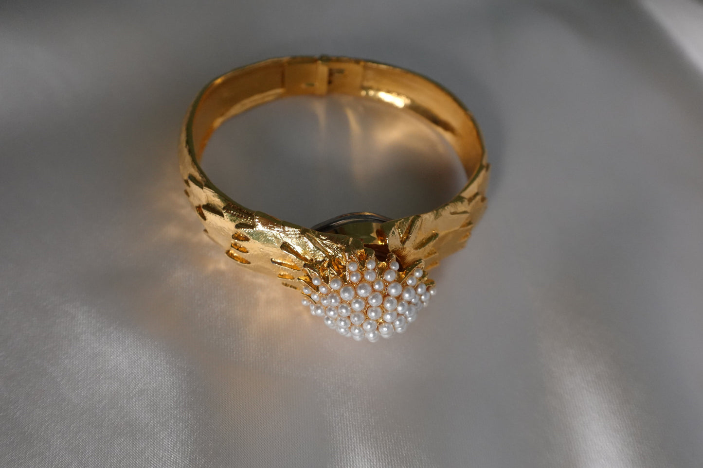 1960s peek-a-boo pearl bangle watch