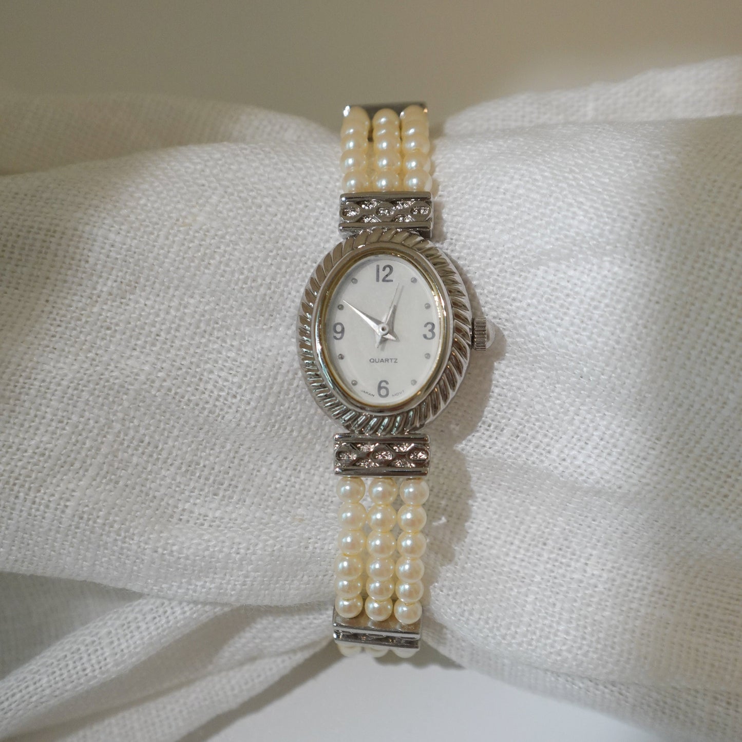 Oval faux peal bracelet watch