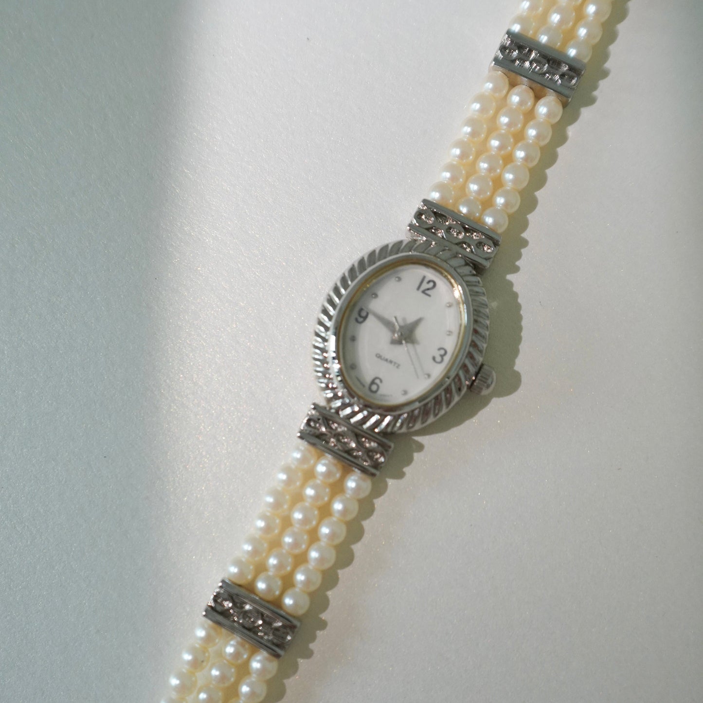 Oval faux peal bracelet watch