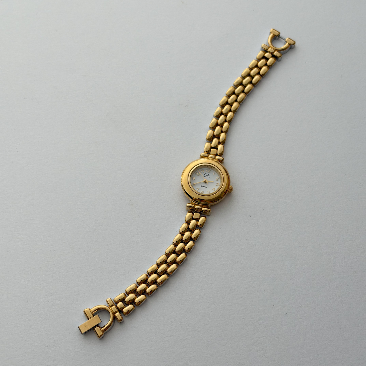 Dual tone vintage watch, full bracelet centred in square photo