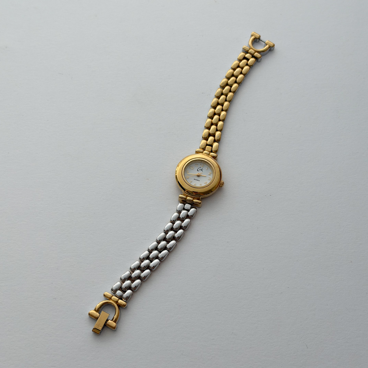 Dual tone vintage watch, full bracelet centred in square photo